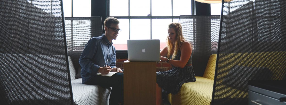 man and women in career coaching conversation